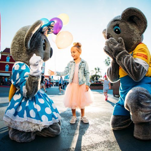 gc-tourism-dreamworld-little-girl-in-pink-tutu-with-belinda-koala-with-kenny-koala